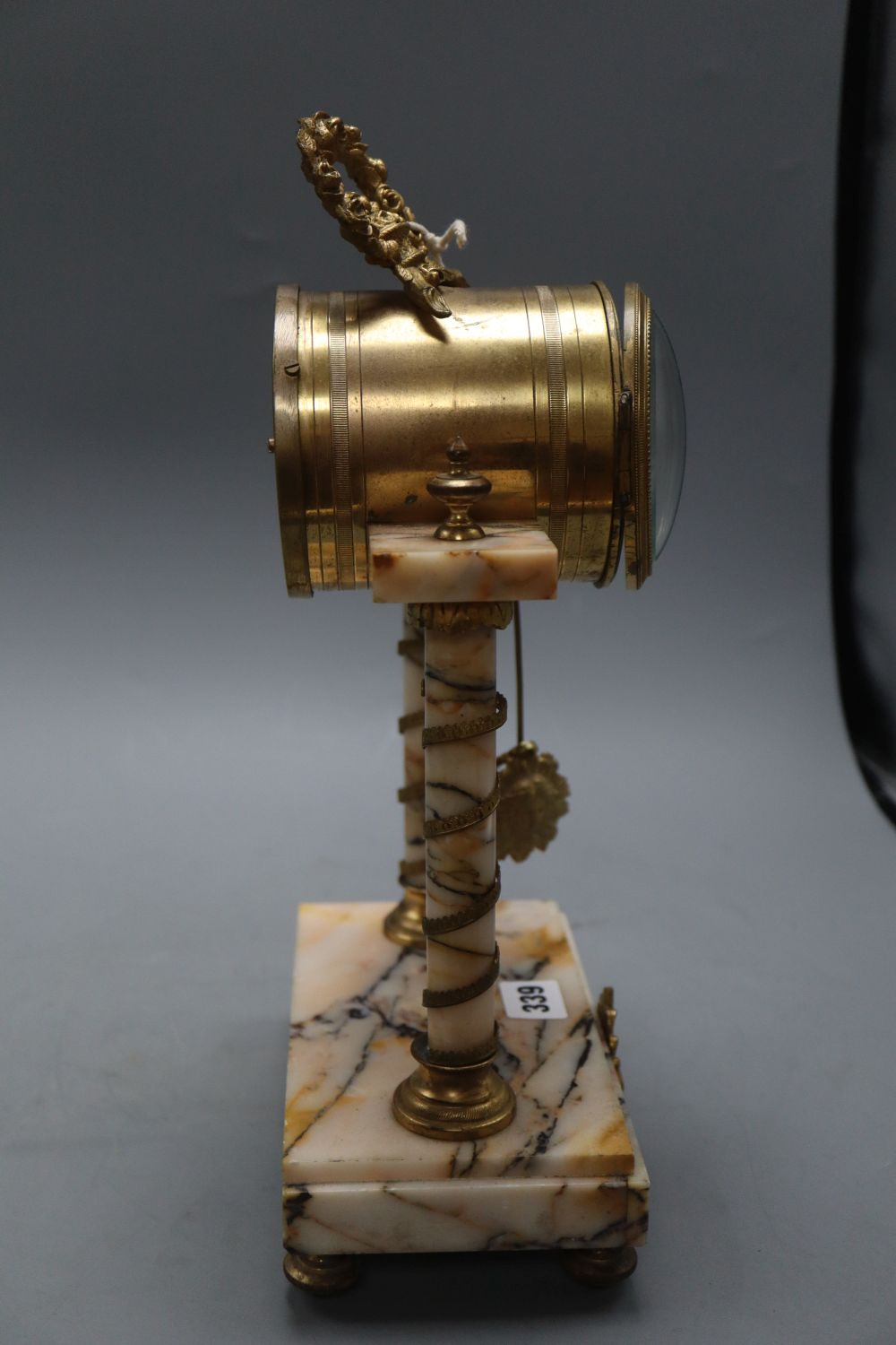 A French peach marble and gilt pillar clock, height 38cm